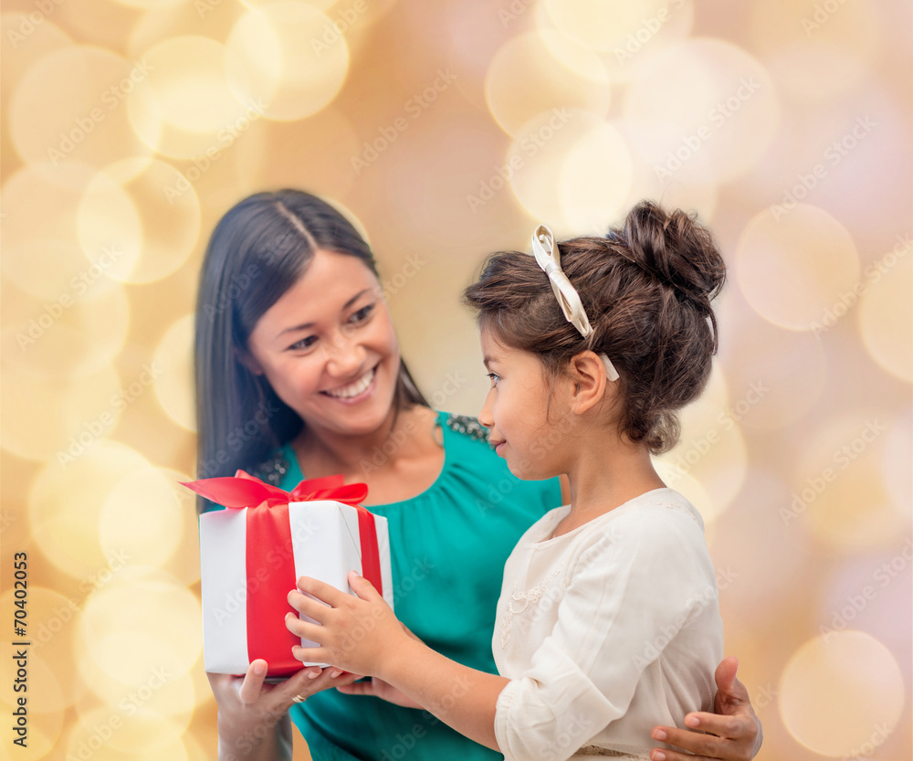 happy mother and child girl with gift box happy mother and child girl with gift box