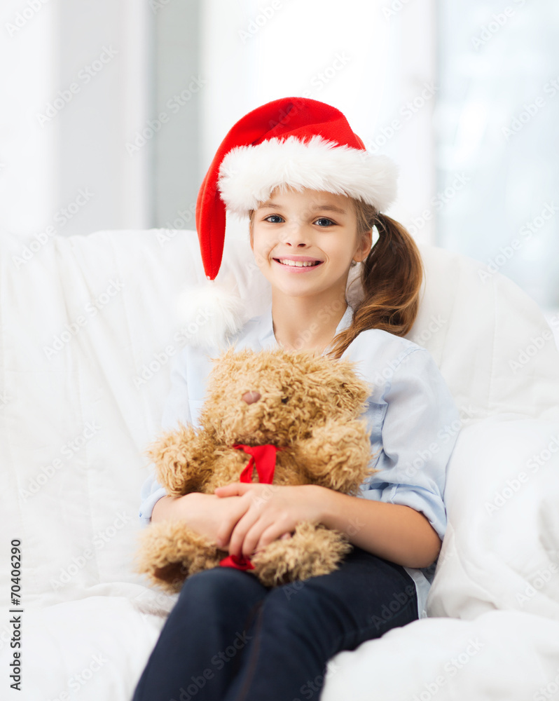 smiling girl in santa helper hat with teddy bear smiling girl in santa helper hat with teddy bear