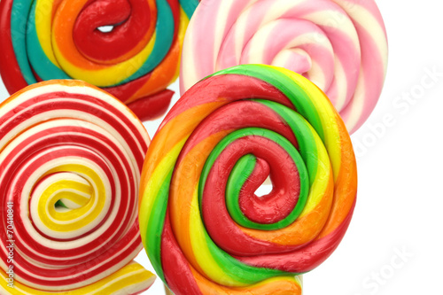 Colorful spiral lollipops on white background. Close-up