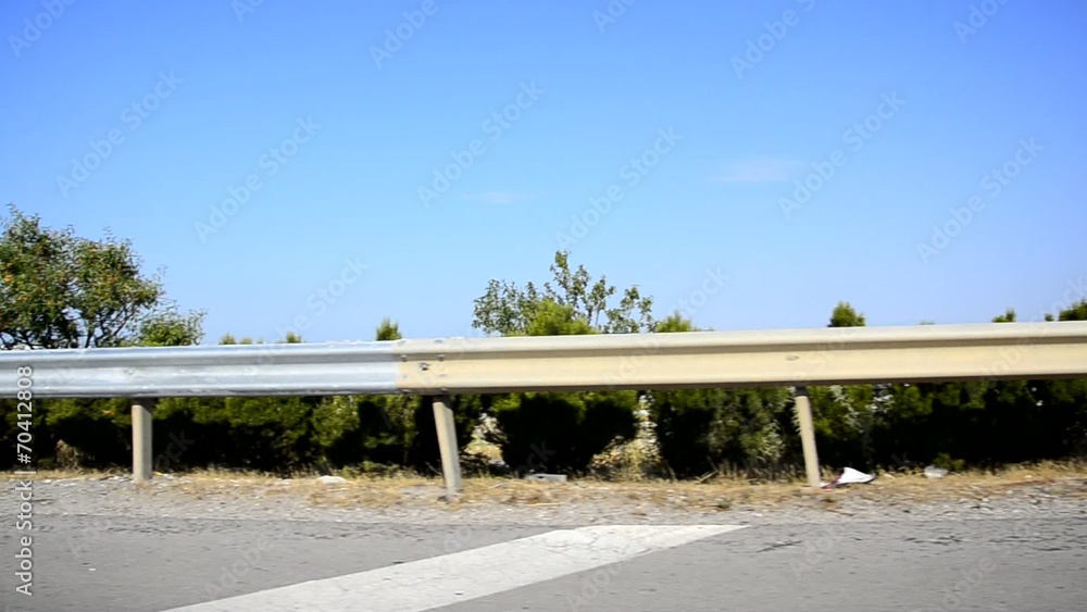 Side view of a Thesaloniki Greece road, fast driving Side view of a Thesaloniki Greece road, fast driving