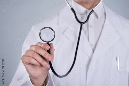 Male Doctor Holding Stethoscope