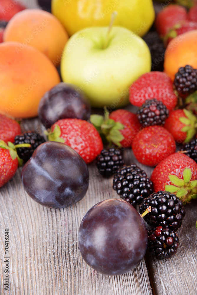 Ripe fruits and berries on wooden background Ripe fruits and berries on wooden background