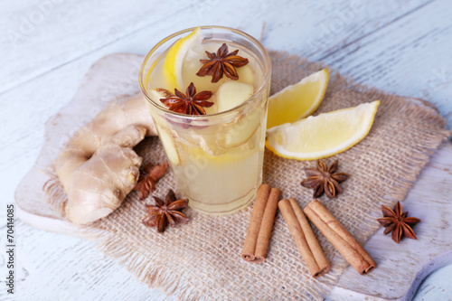 Glass of ginger drink with lemon