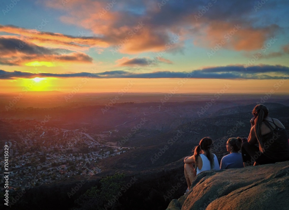 Hikers Watching a Colorful Sunset over San Diego, California