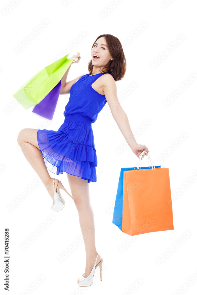 happy young fashion woman with shopping bags.