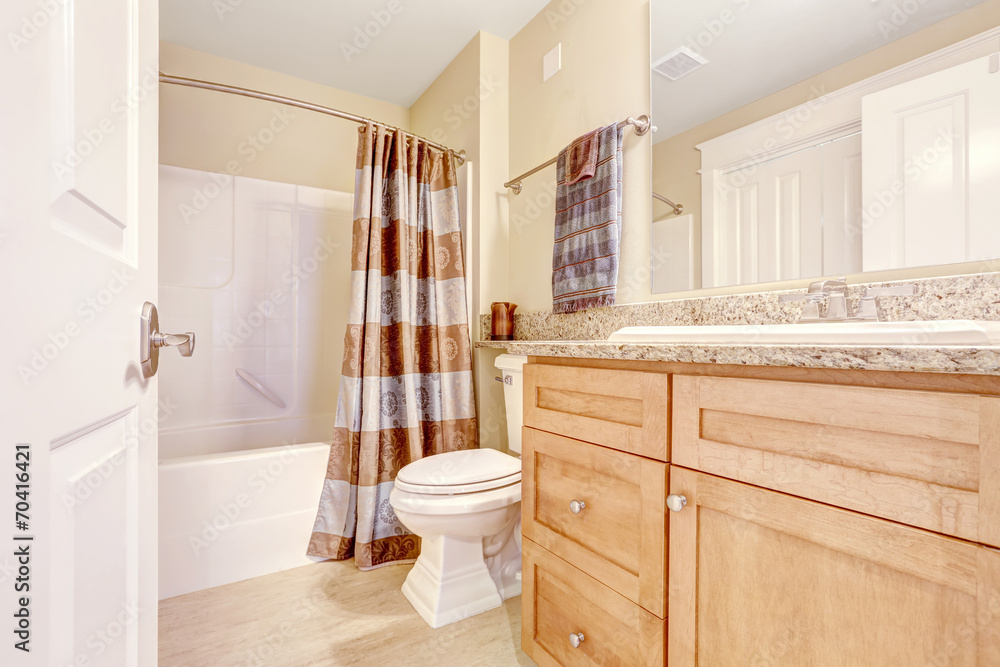 Clean bathroom with brown curtain Clean bathroom with brown curtain