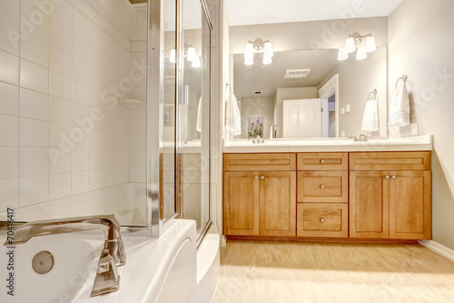 Bathroom interior with bath tub and shower