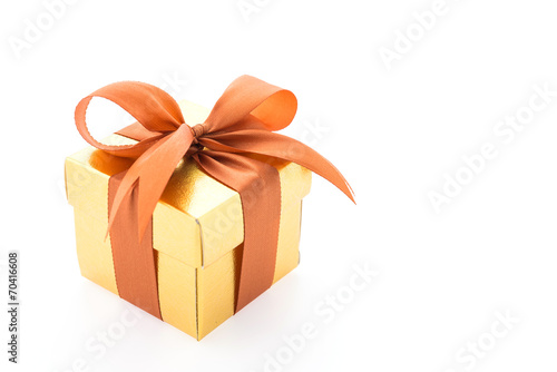 Gold gift box isolated on white background © siraphol
