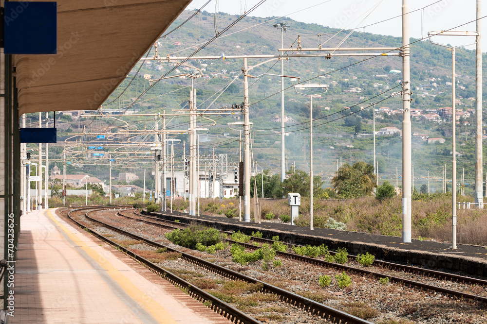 Naklejka premium Train Station with train tracks