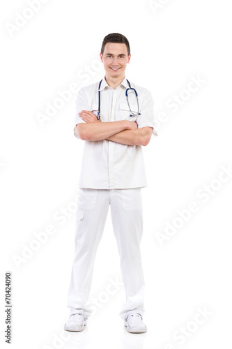 Smiling male nurse posing with arms crossed