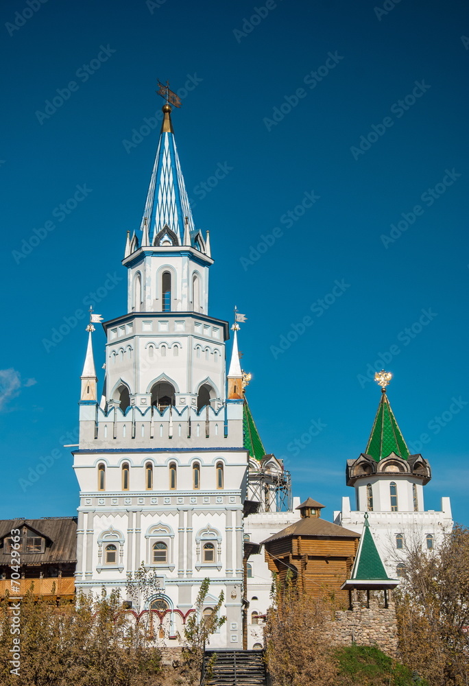 Russian fortress with colorful ornate towers and weathervanes