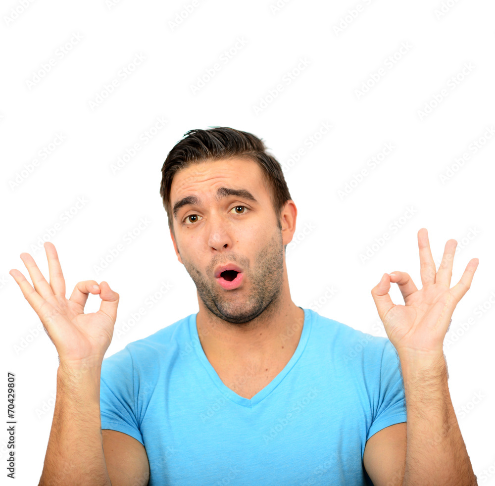 Portrait of funny man showing OK gesture with hands against whit Portrait of funny man showing OK gesture with hands against whit
