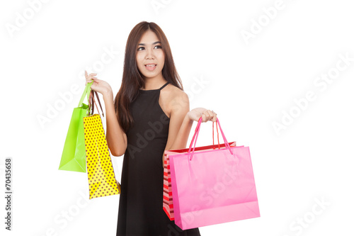 Beautiful Asian woman hold shopping bags look away © halfbottle