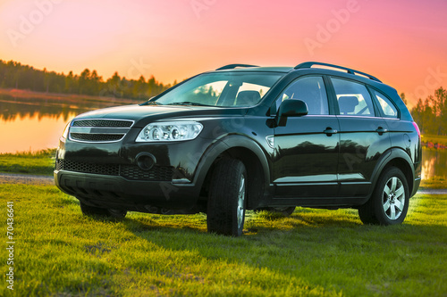 SUV - Black car with sunset background