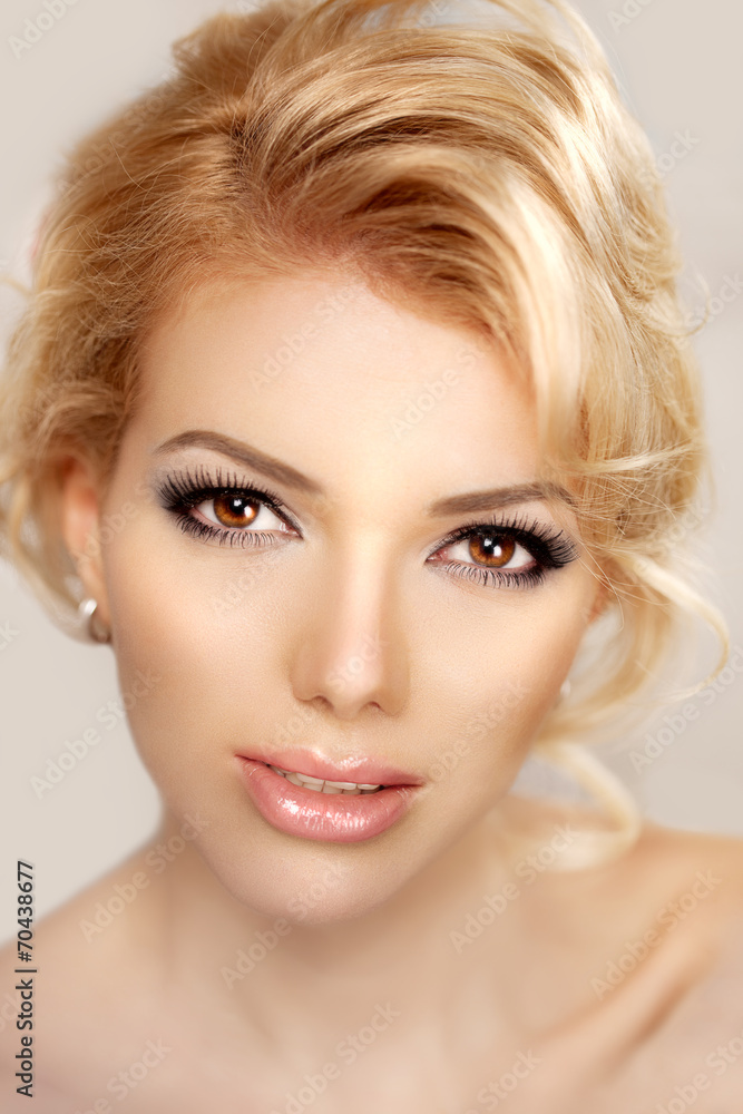 Woman face close up. A pretty young blond trendy. Girl with a be Woman face close up. A pretty young blond trendy. Girl with a be