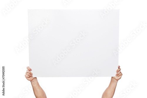 Hands holding a blank banner, isolated on white photo