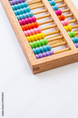 Chinese calculator with colorful beads - Close-up. Concept photo