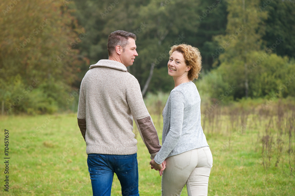 Happy couple walking in the countryside Happy couple walking in the countryside