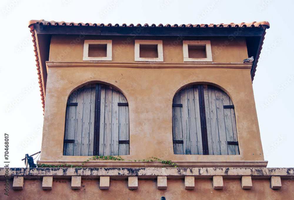 Obraz premium windows of Italian style building at Palio Khao Yai