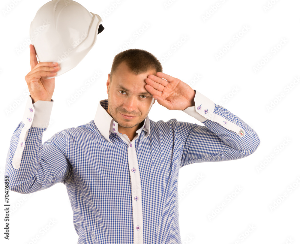 Man Removing Hard Hat to Wipe Forehead with Hand Man Removing Hard Hat to Wipe Forehead with Hand
