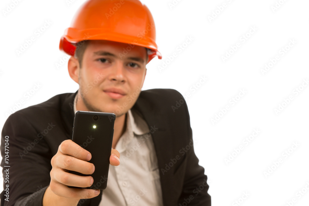 Engineer Looking at Camera While Holding Phone Engineer Looking at Camera While Holding Phone