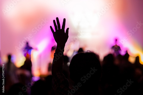 christian music concert with raised hand photo