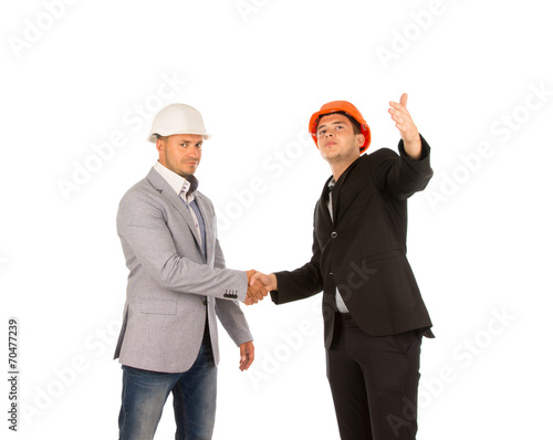 Two Middle Age Building Designers Shaking Hands