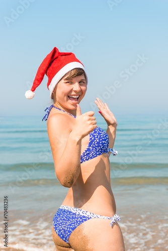 girlfriend happy Santa Claus on the sea