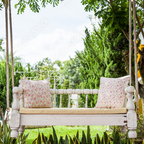 vintage swing and light pink flower pillow photo