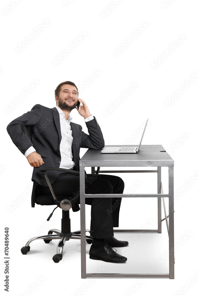 smiley businessman talking on the mobile phone smiley businessman talking on the mobile phone