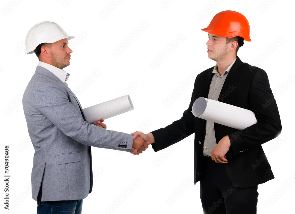 Young architect shaking hands with a businessman Young architect shaking hands with a businessman