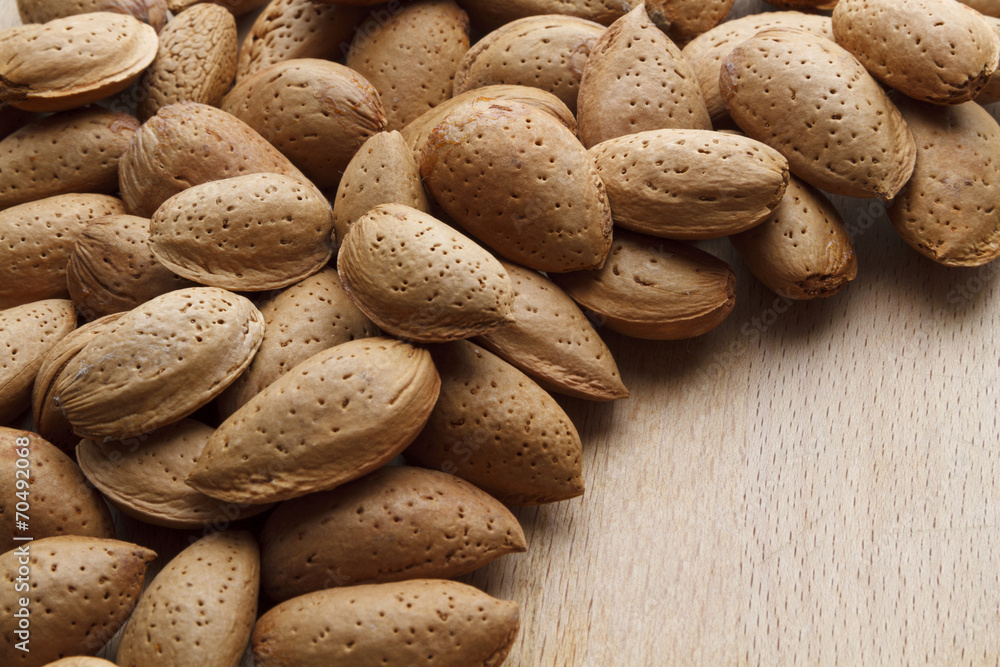 Fototapeta premium Almond on wooden background