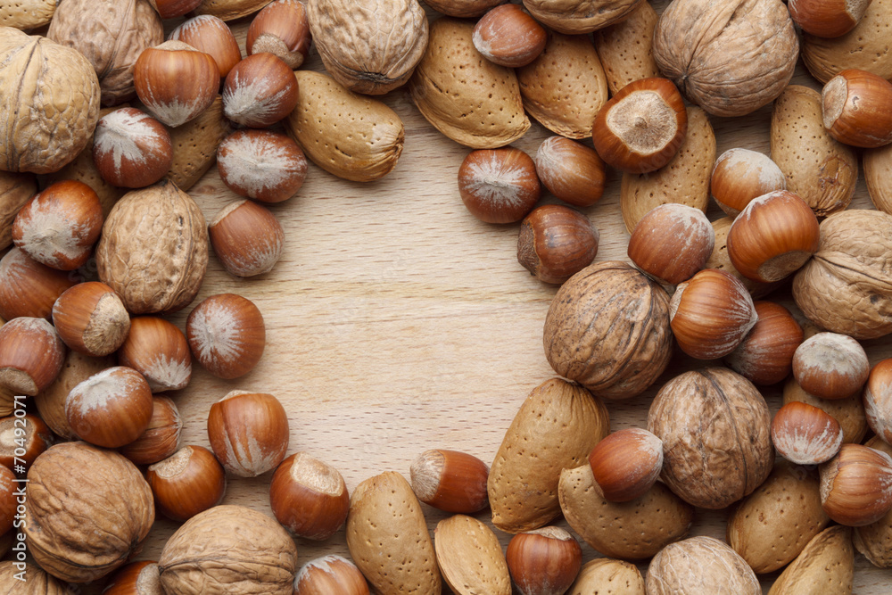 Nuts on wooden background