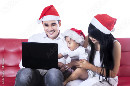 Happy family playing with laptop