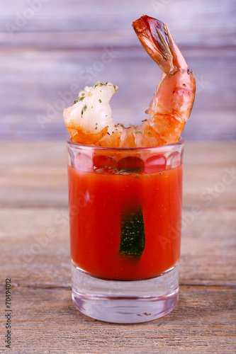 Fresh boiled prawns in a glass with tomato sauce