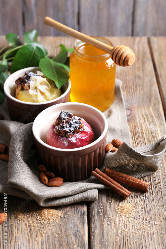 Baked apples in bowls on table close up Baked apples in bowls on table close up