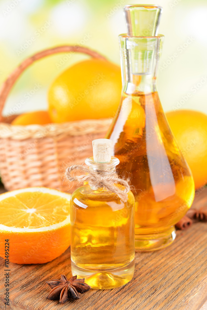 Orange oil on table on light background Orange oil on table on light background