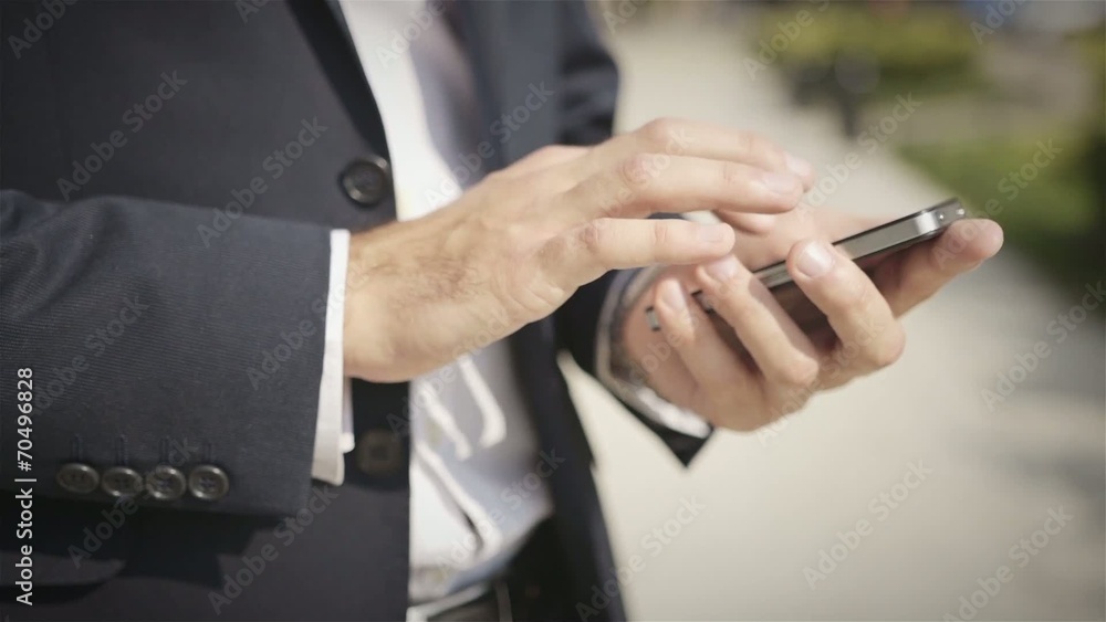 Close up of a man using mobile smart phone outdoor Close up of a man using mobile smart phone outdoor