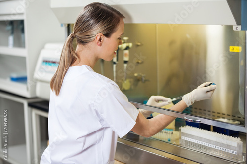Researcher Filling Liquid In Testtube