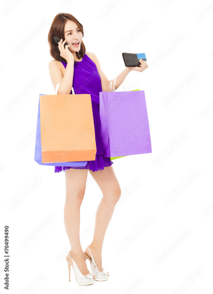 beautiful woman with shopping bags talking on phone beautiful woman with shopping bags talking on phone