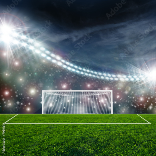 Fototapeta Naklejka Na Ścianę i Meble -  Soccer ball on green stadium arena
