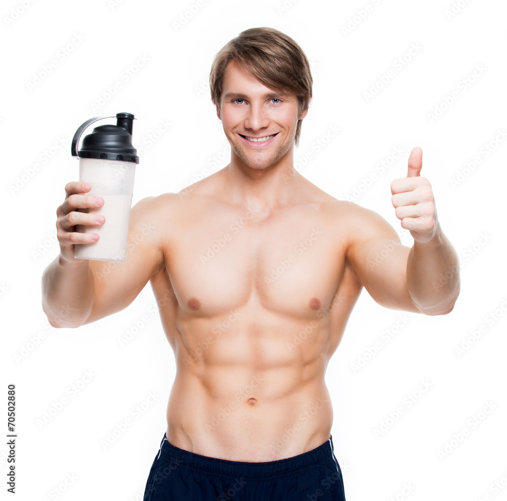 Fototapeta premium Young handsome bodybuilder with a bottle.