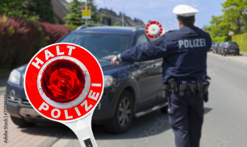 Tableau sur toile Polizist mit Anhaltestab