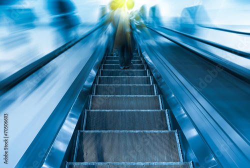 Empty escalator or moving stair. Also called stairway or staircase. Modern architecture design with step, glass for lift people up floor building i.e. shopping mall, airport, metro and subway station.