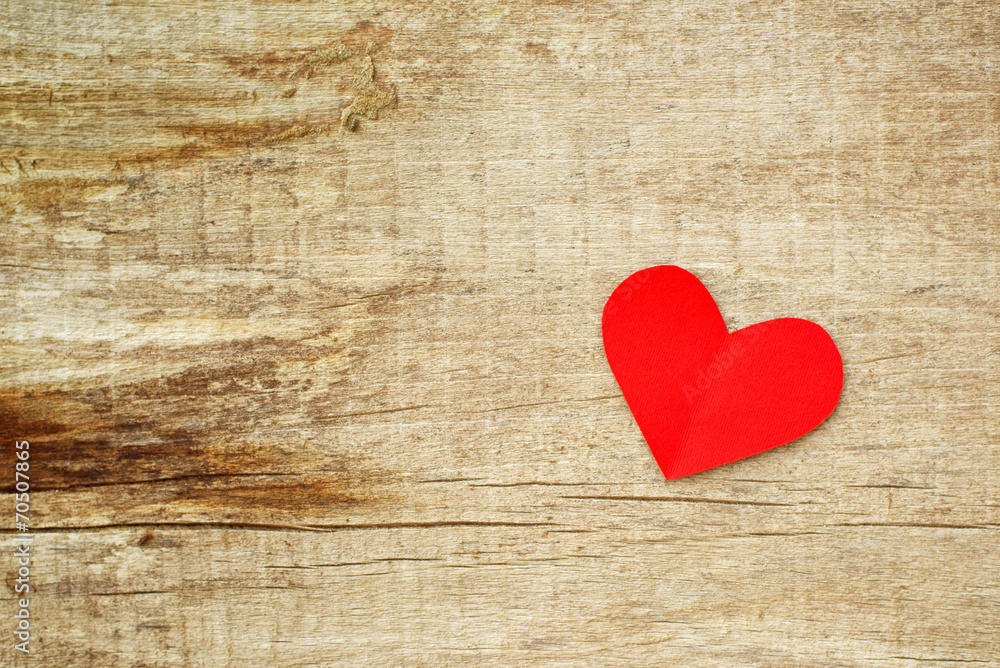 Red paper heart on grunge wooden background Red paper heart on grunge wooden background