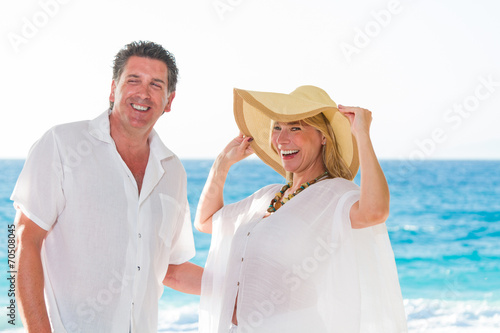 Mature couple at the beach © Netfalls