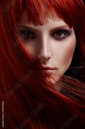 Fotografi Beautiful portrait of woman with red hair