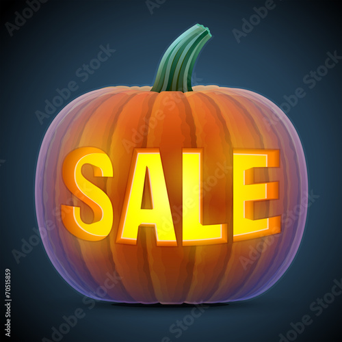 Halloween pumpkin with carving. Jack-o-lantern with word SALE