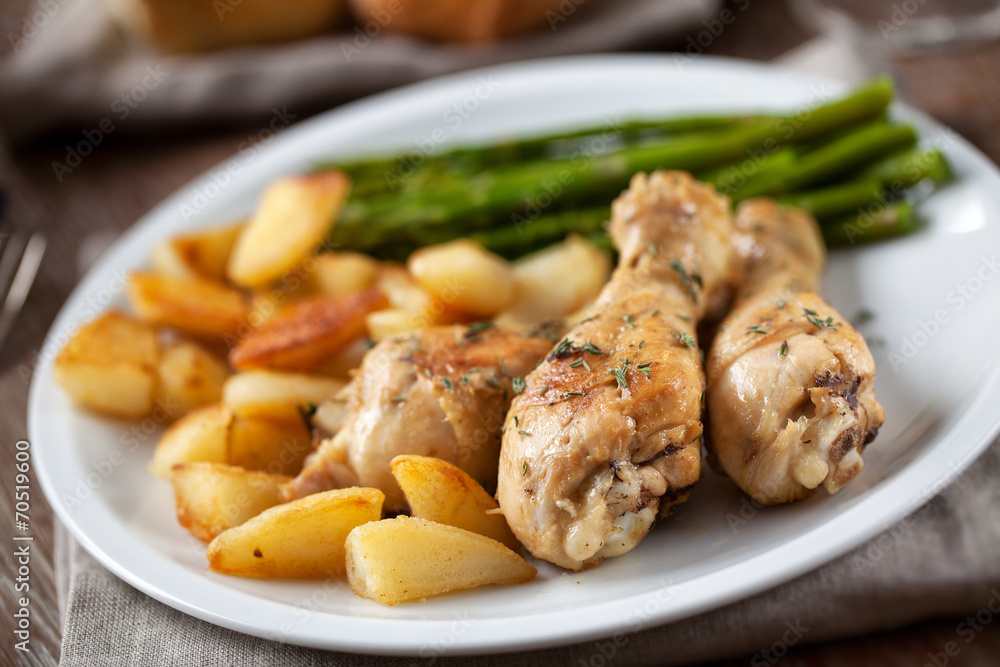 Roast chicken with potatoes and asparagus