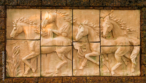 Low relief sculpture of horse